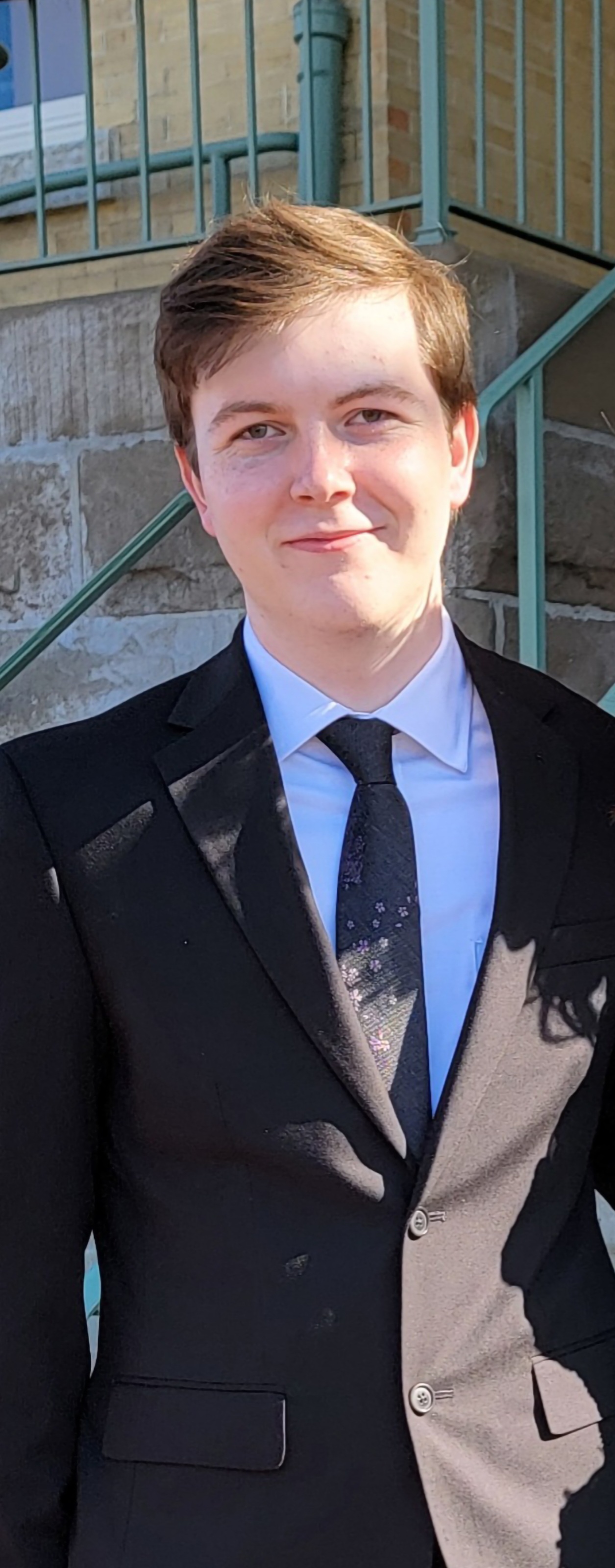 A photo of William Boulle in a suit